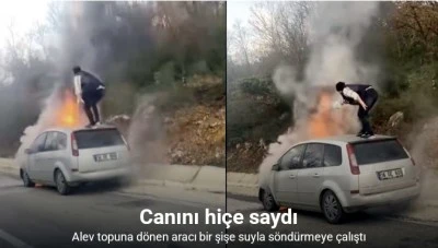 Otomobil alev topuna döndü, canını hiçe sayıp yangını söndürmeye çalıştı